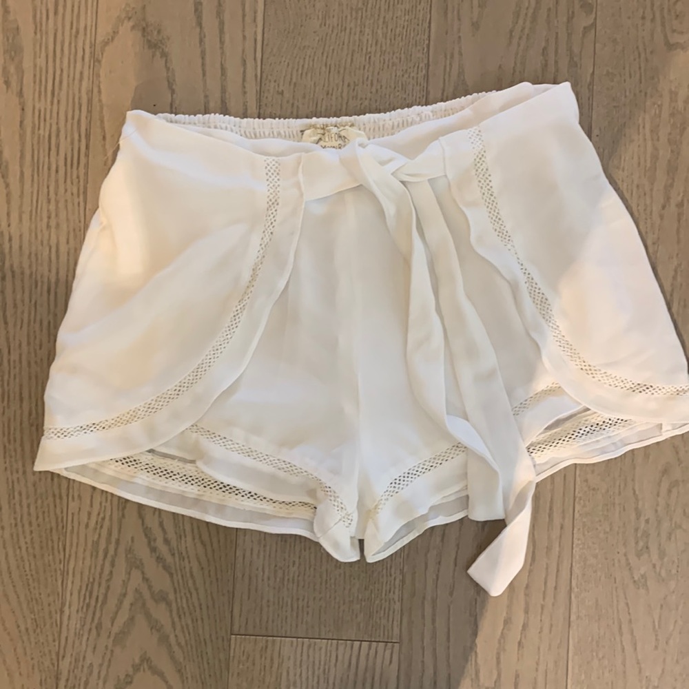 Wrap style shorts with crochet inlay at hem